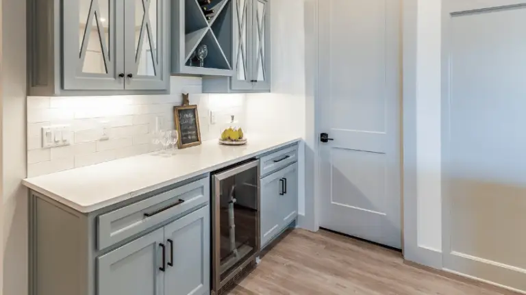 Butler's pantry with a wine chiller in a luxury custom home