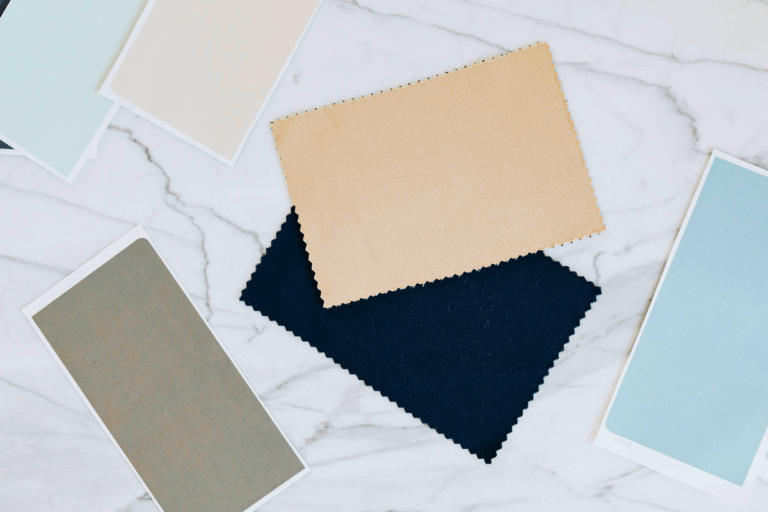 Paint and fabric samples on a marble counter